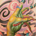 Tattoos - severed dragon lady arm with flower - 22242